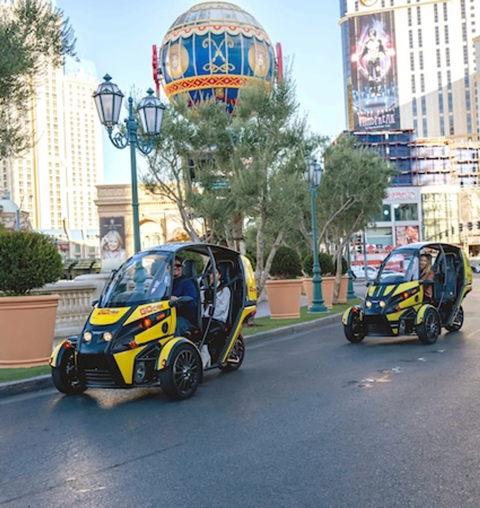 Yellow GoCar driving along the Las Vegas Strip in the evening